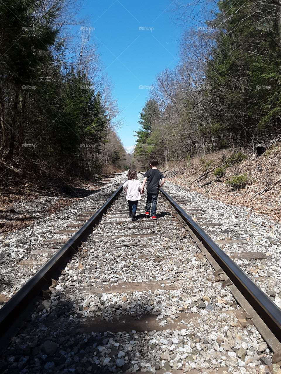 kids on train tracks
