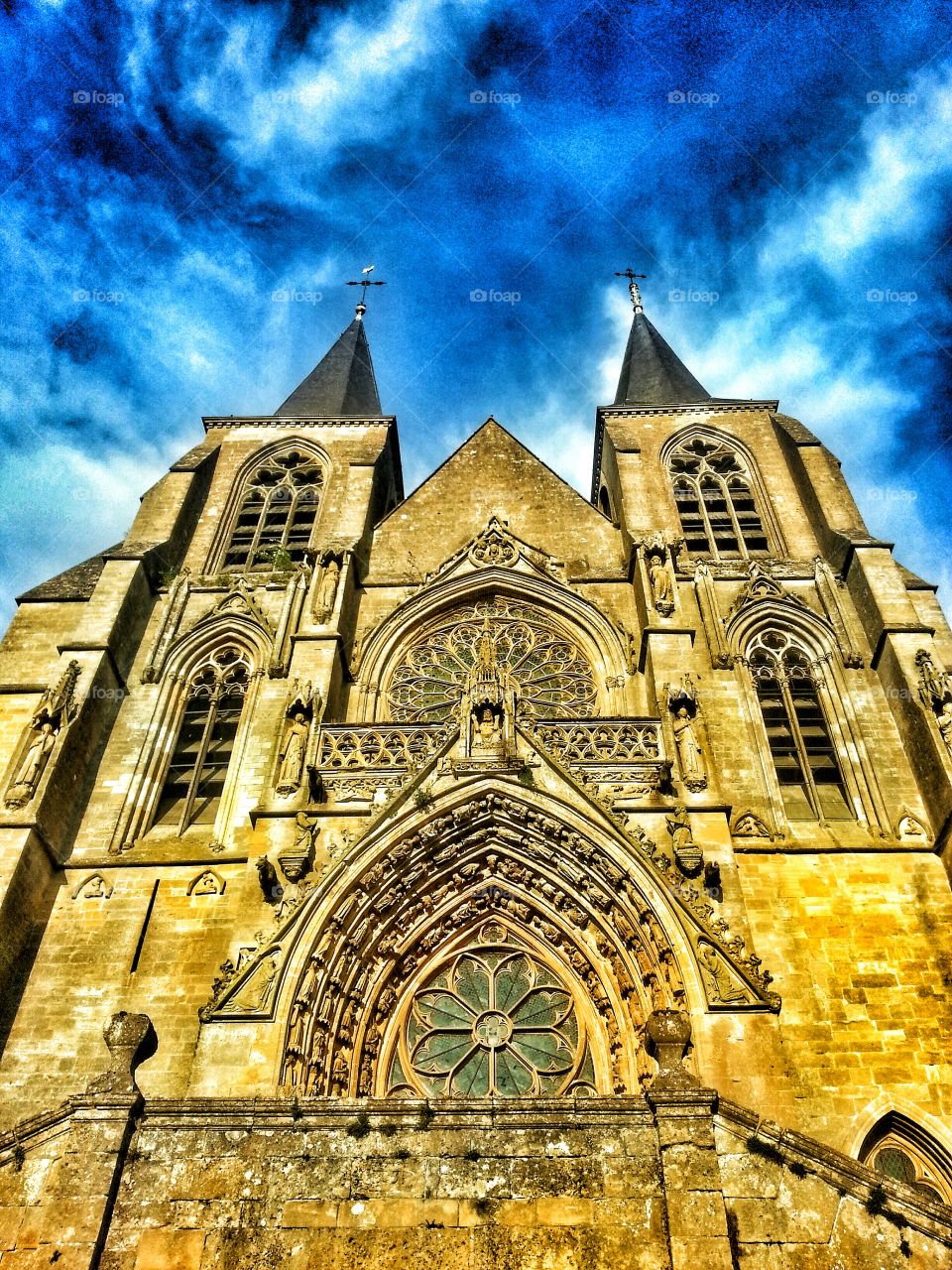 Cathedral made of yellow stone in the Gaume region, southern Belgium