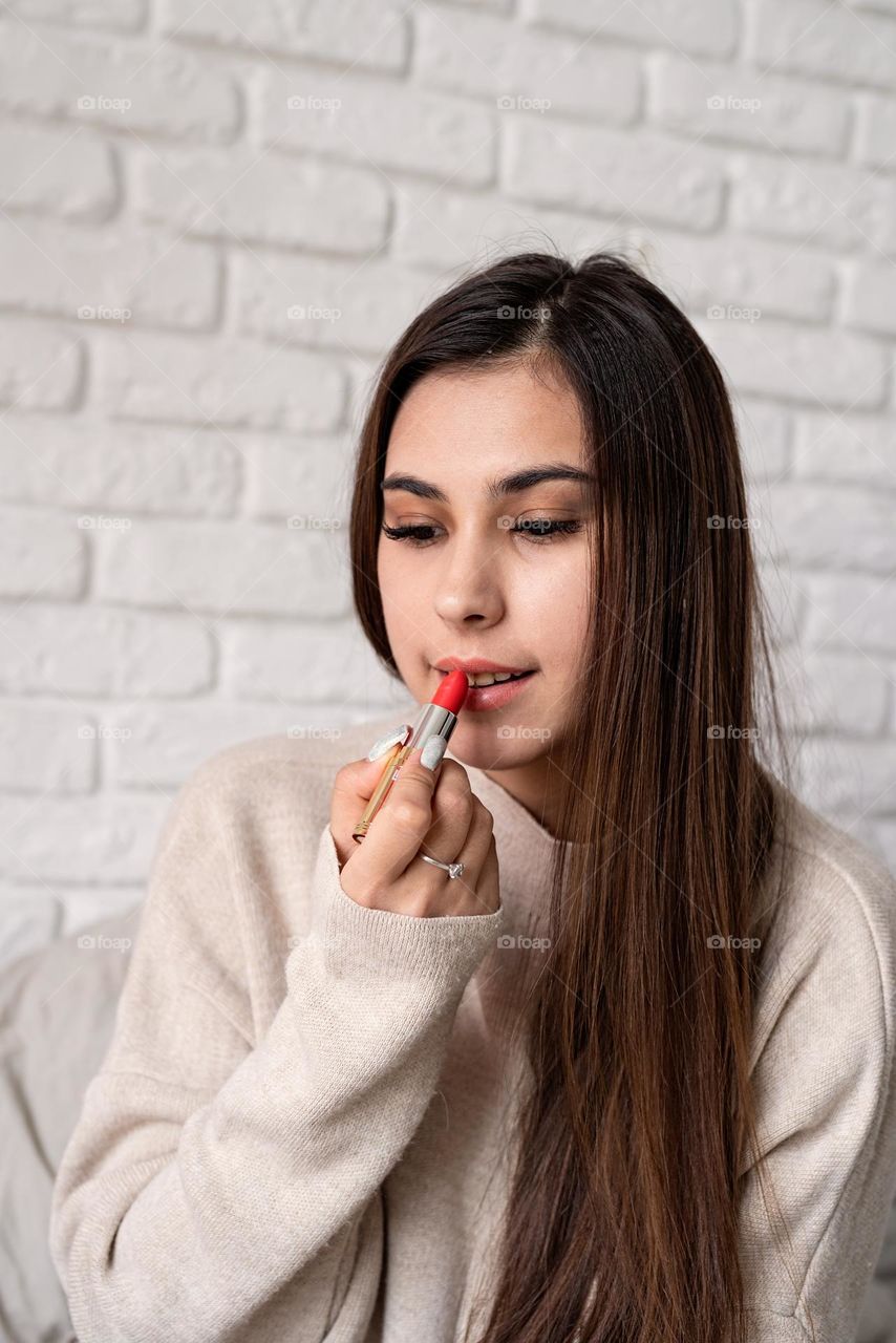 woman using cosmetics