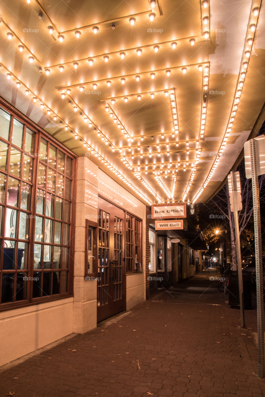 Box office at a local theatre  at night with the lights sparkling