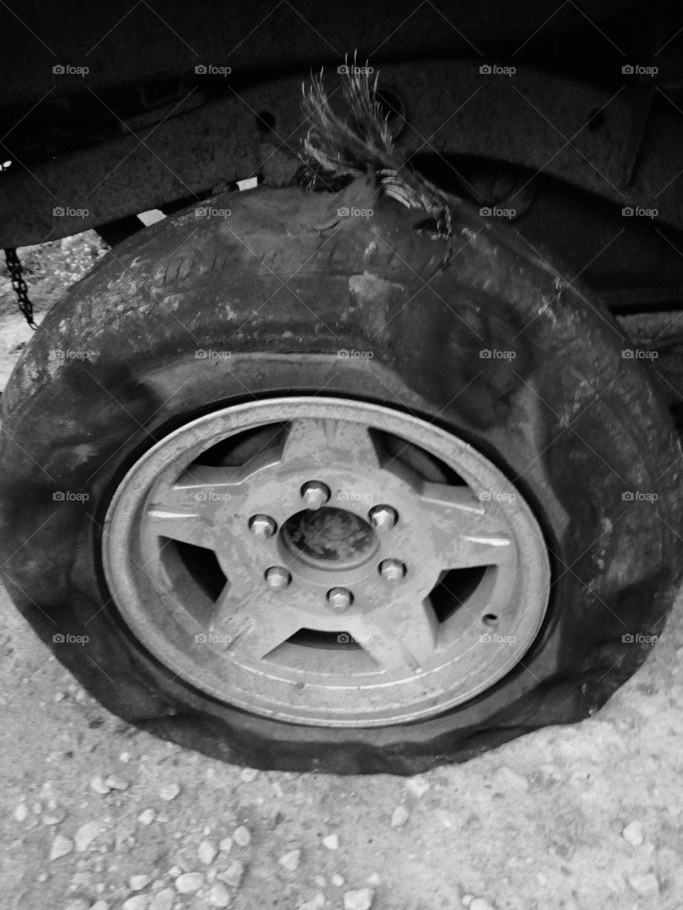 torn tyre on alloy rim
