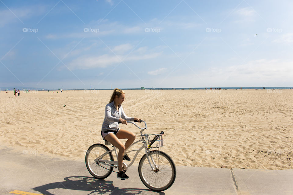 Cyclist at Venice Beach Boardwalk, Los Angeles 