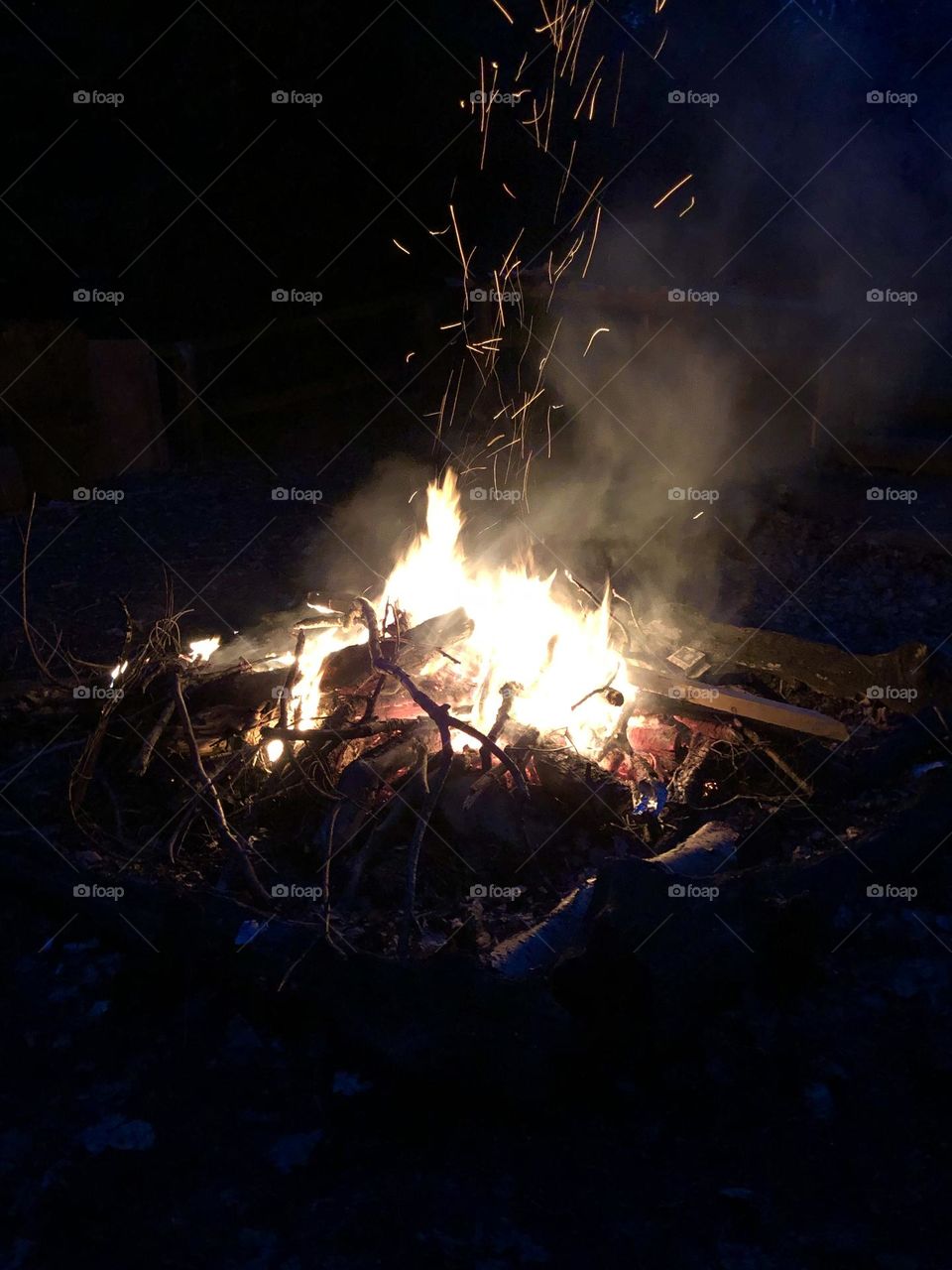 Campfire with sparks and smoke