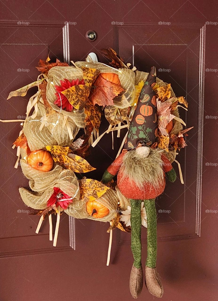 festive Fall harvest gnome wreath decoration on the front door of an Oregon suburban home