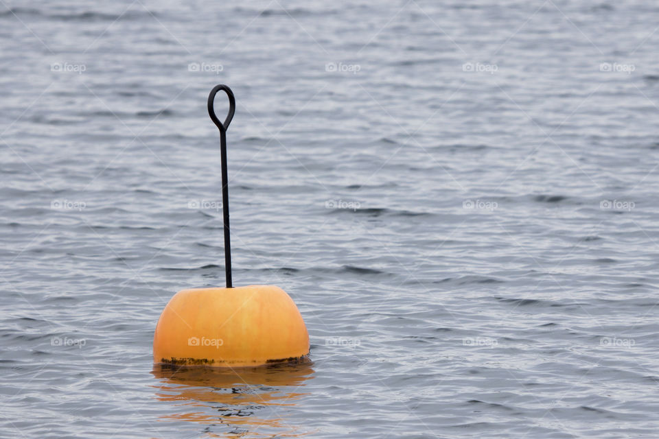 Orange buoy in the water 