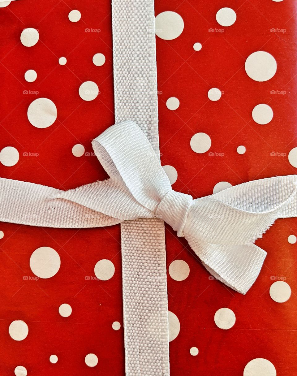 Christmas gift red with white dots and a bow
