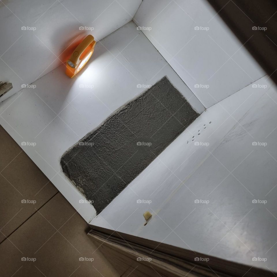 Repaired base of kitchen cabinet