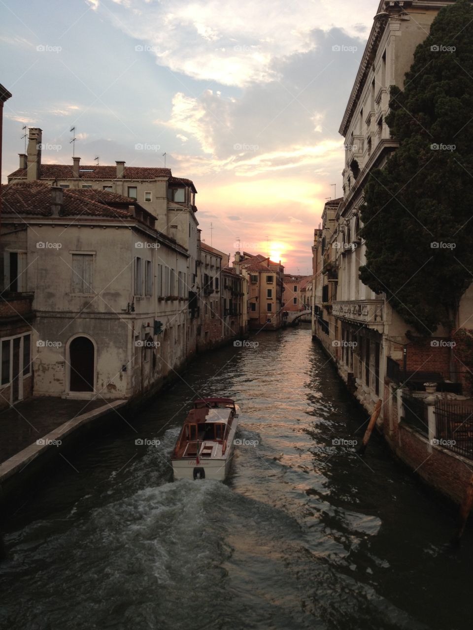 A boat navigating the canals of Venice, italy
