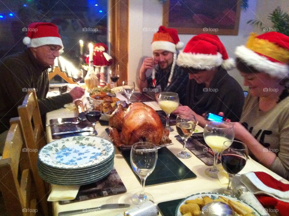 Family eating diner at Christmas night