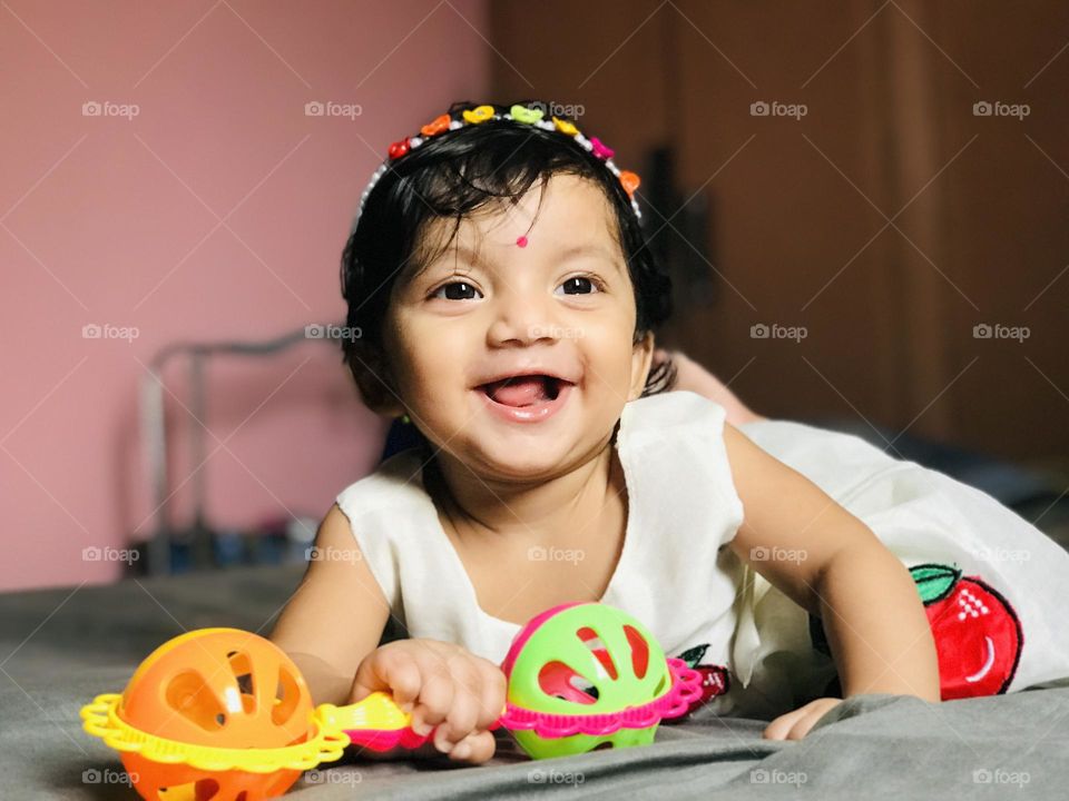 Cute Indian baby girl down to up view 