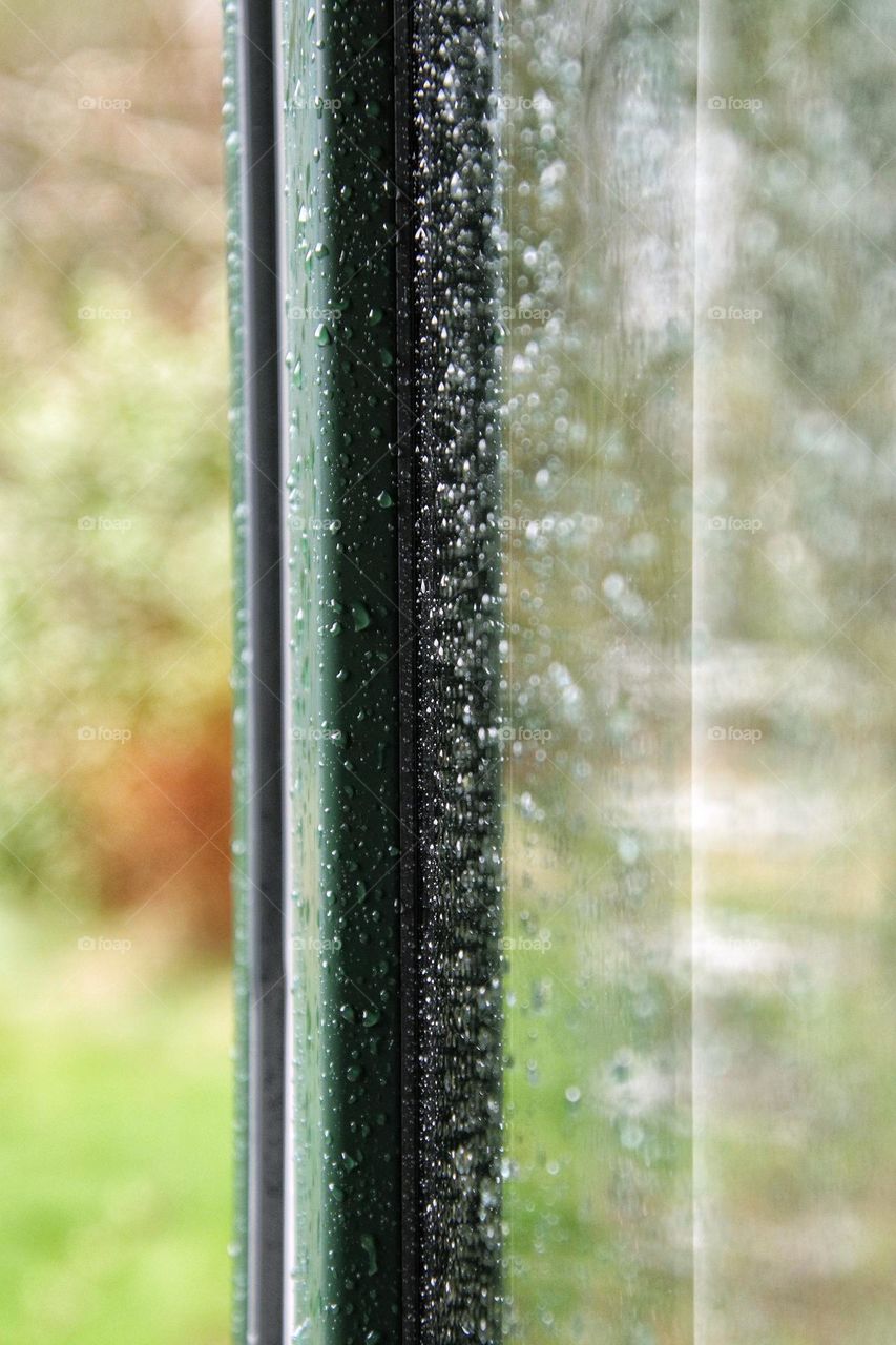 Close up of raindrops on window after rain 