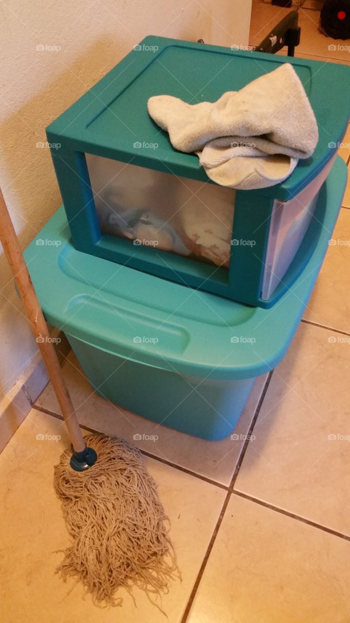 Storage boxes and a mop