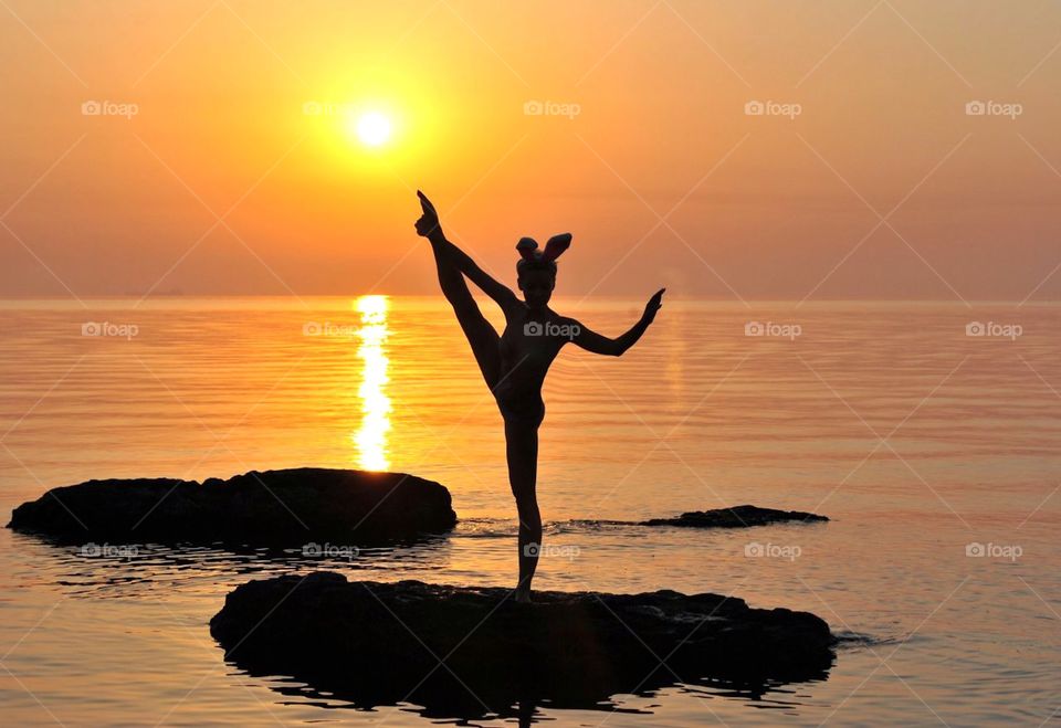 Silhouette of women doing yoga