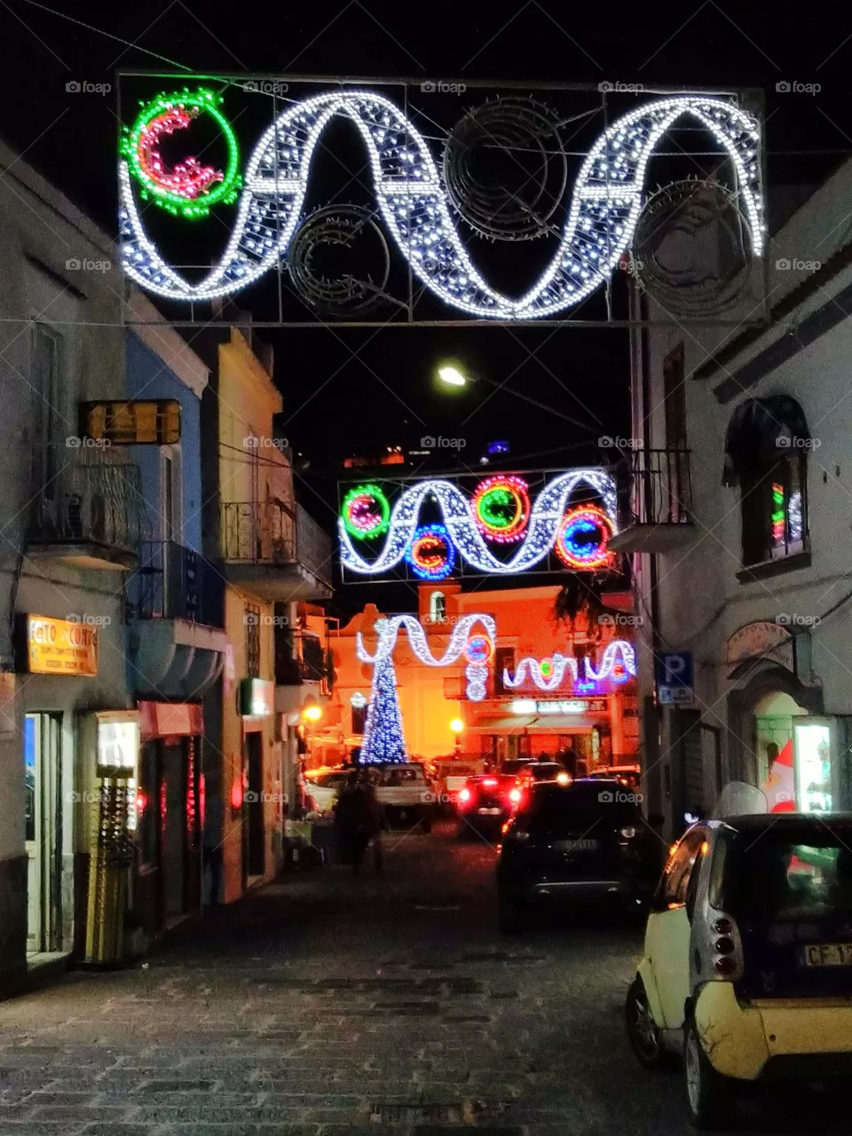 Colorful wave-shaped Christmas lights in Panza on the Italian island of Ischia