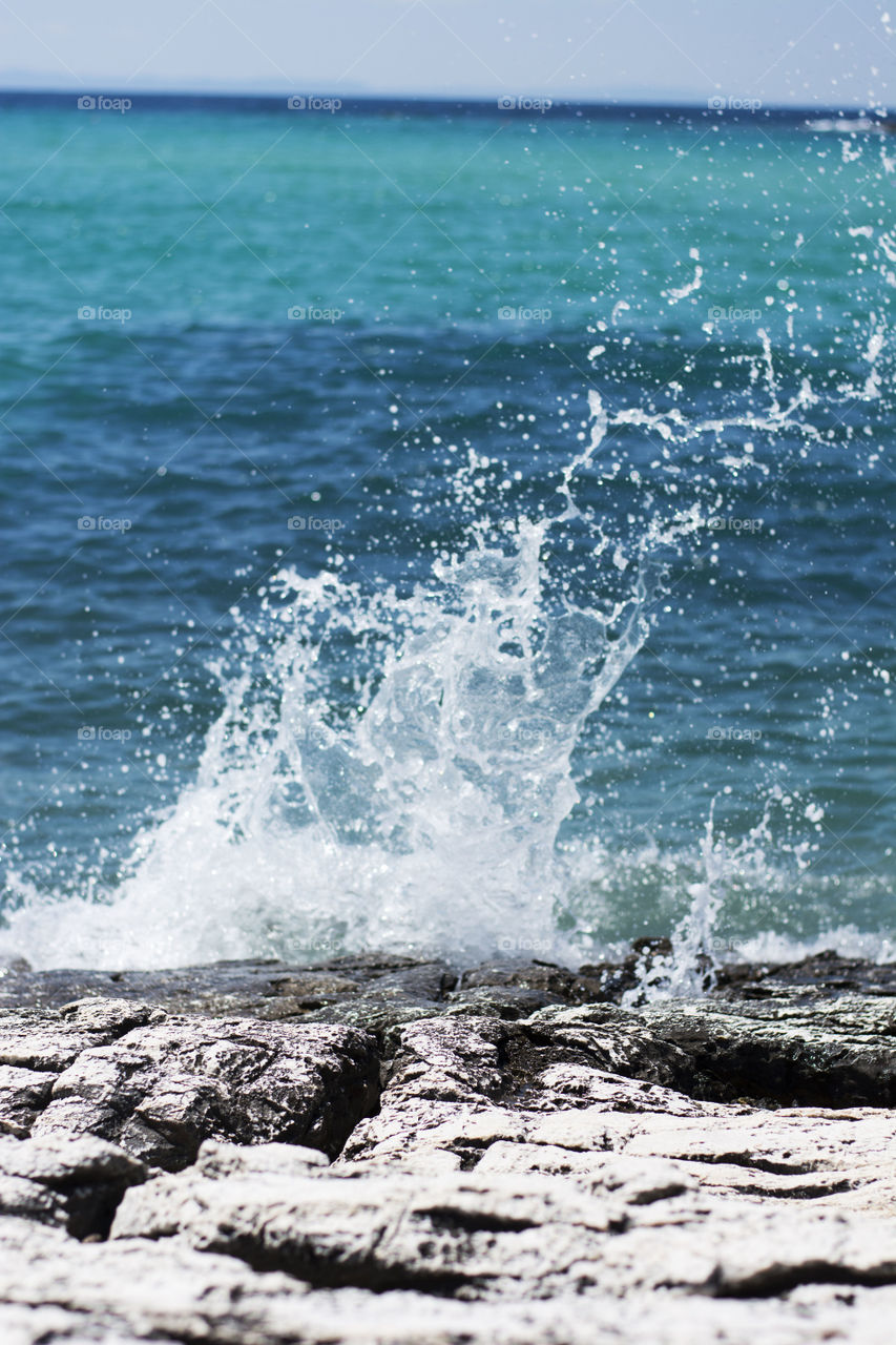 waves splashing. waves splashing aganst the rocks