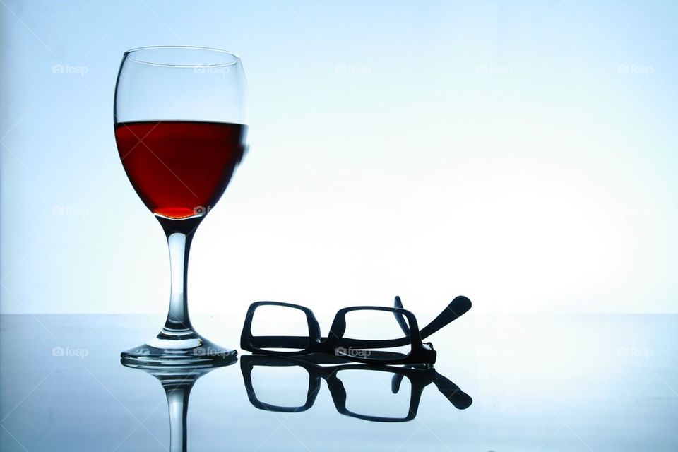 alcoholic drink and a pair of eyeglasses