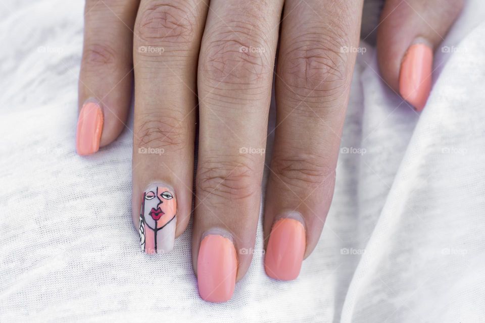 Finger nails with art painted manicure