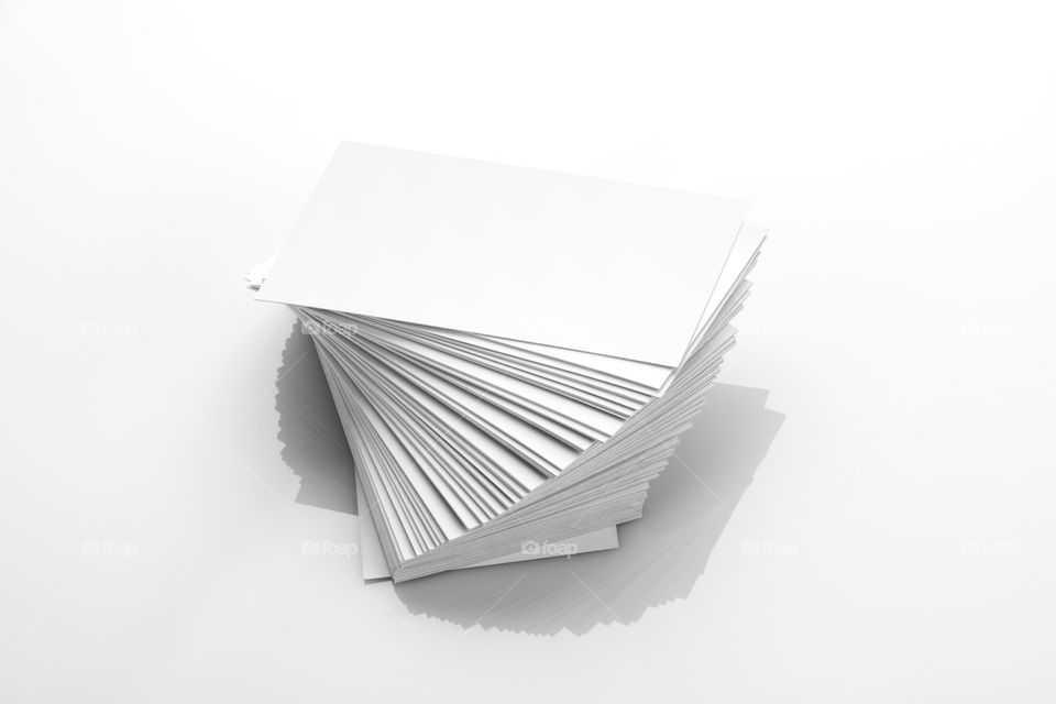 Blank white Business cards stack on white reflective background