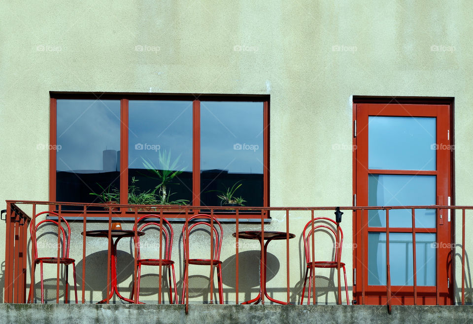 View of building exterior with window by day.