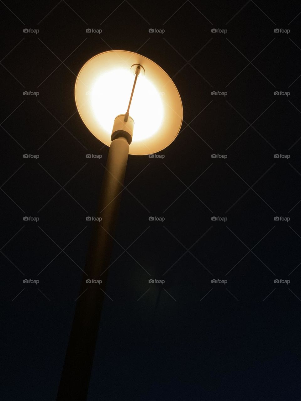 Street lamp against black background