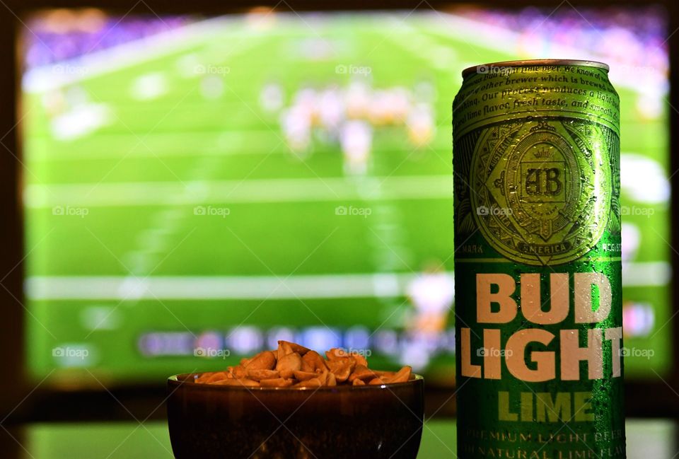 Enjoying football game with Bud Light