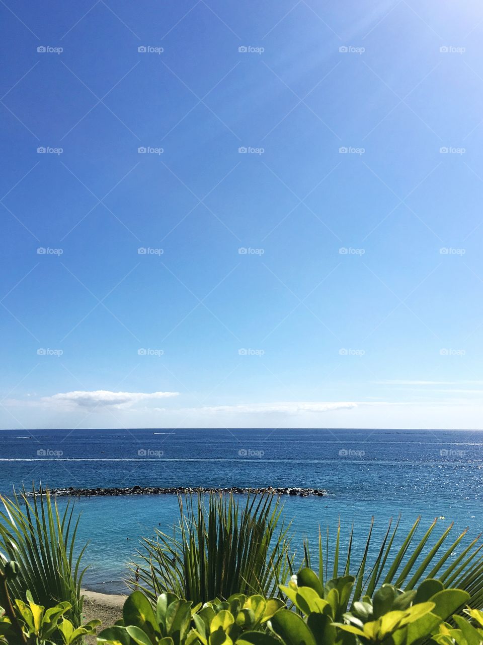 Turquoise ocean water along the lush coast line of the Canary Islands, Spain.