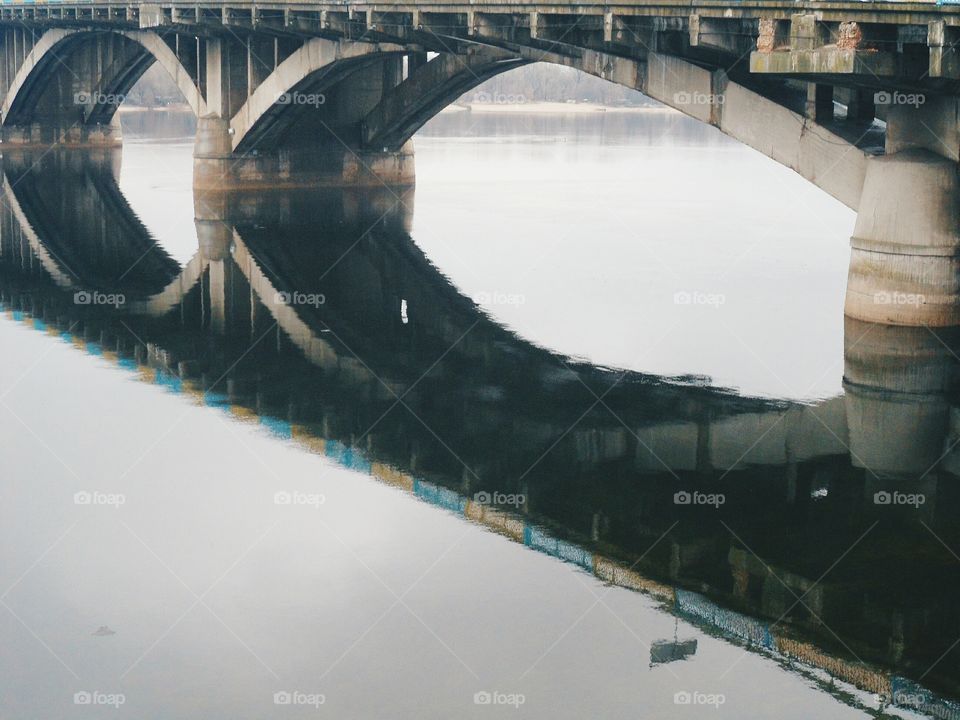 reflection of the bridge in river Dnepr