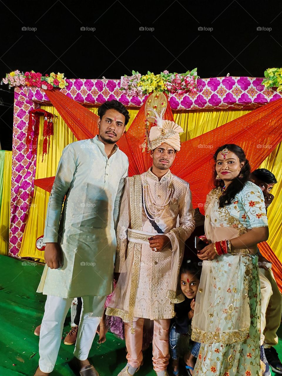 this photo capture by  my mobile phone iqoo Neo 6 and me and my mosi with my mama on his merriage stage function