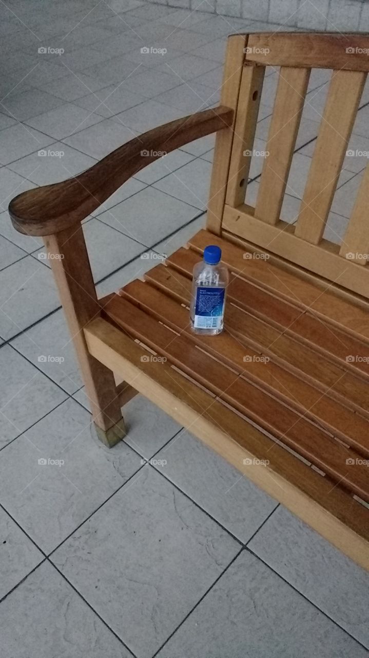 water bottle left on the bench
