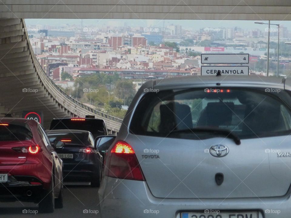 Car traffic jam at the entrance to a large city. Despite this drawback, many people still use their personal car on a daily basis for its flexibility.