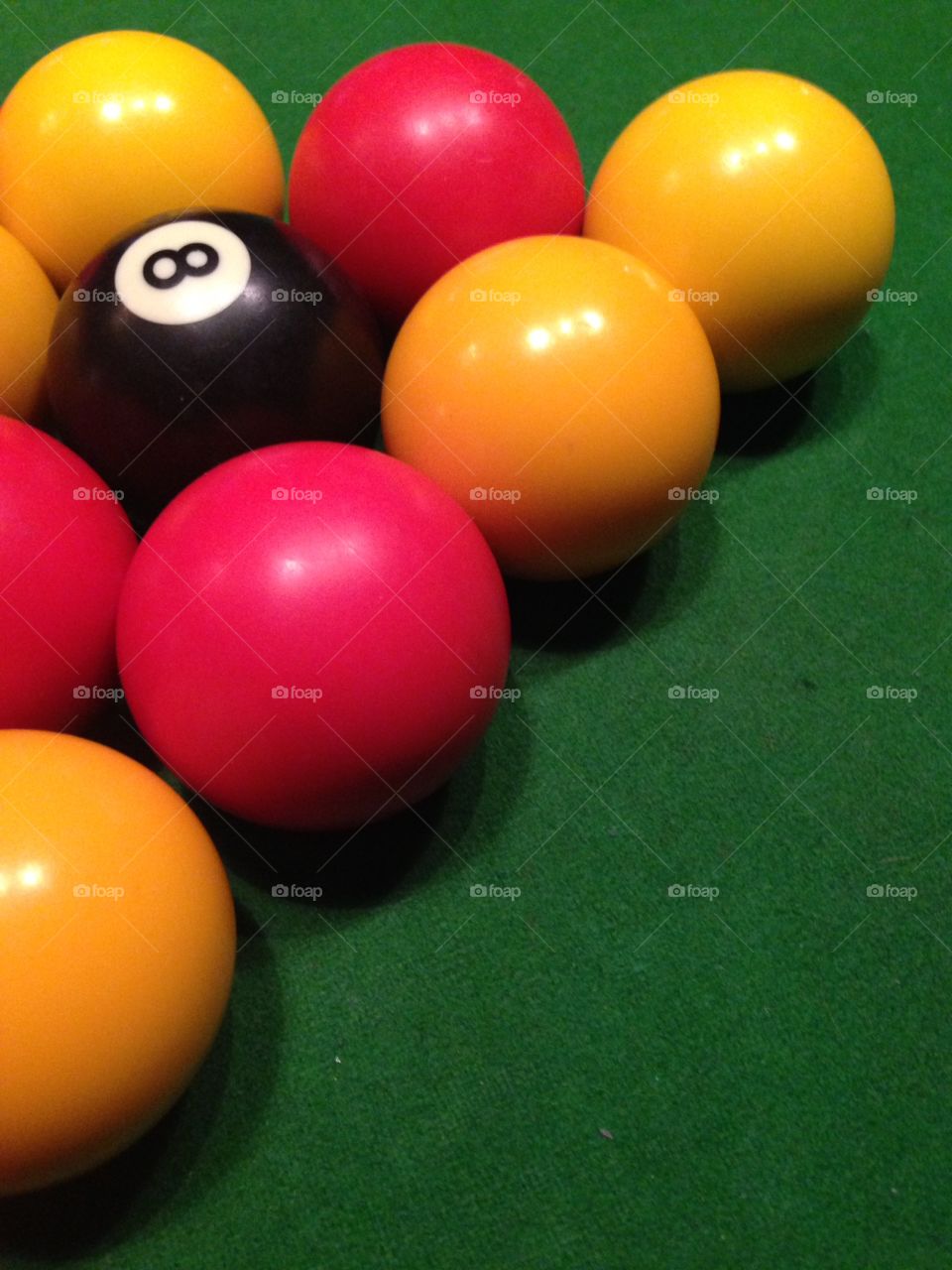 Pool table green felt red yellow balls 