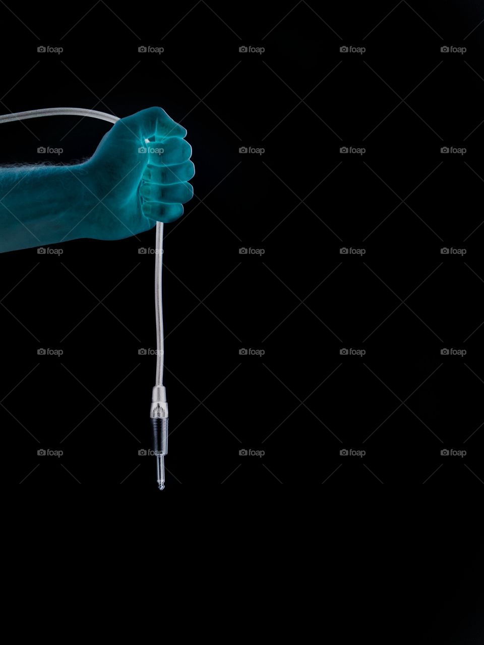 Neon hand pulling out audio jack. 