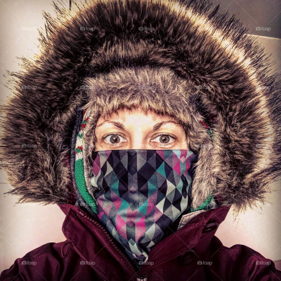 Woman preparing for winter, bundling up for cold weather, ready to walk to the store, baby it’s cold outside, furry hat with furry hood, Columbia product shot 