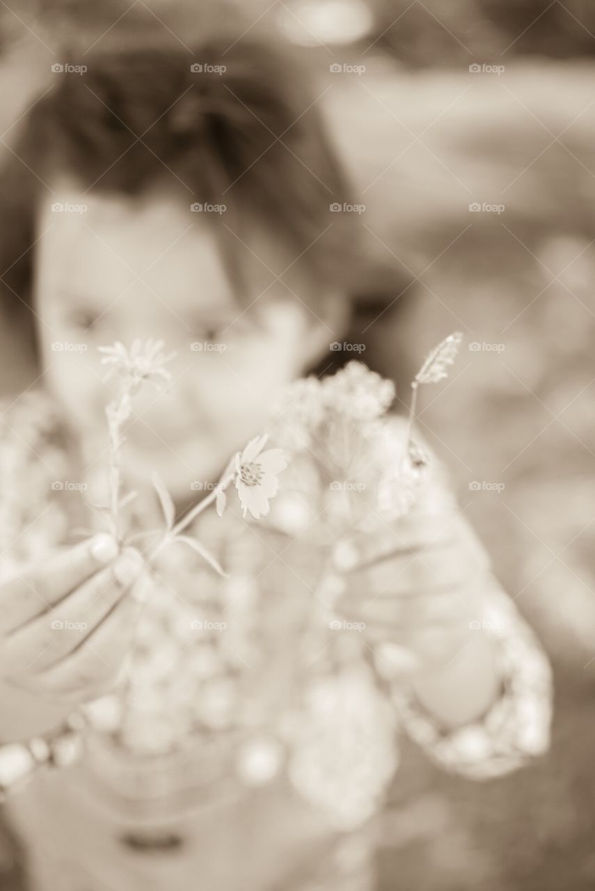 Little Girl Giving Flowers