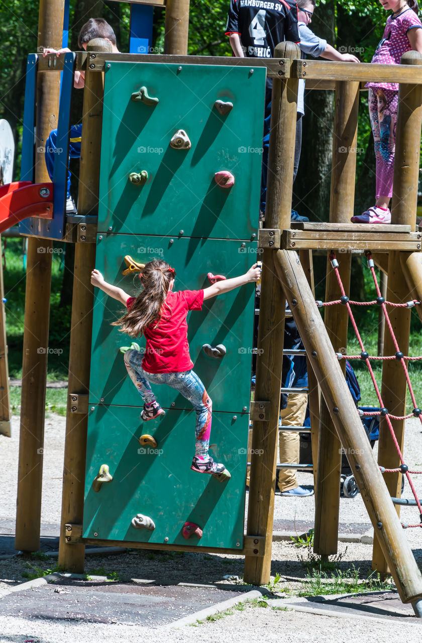 Girl climbing on the wall