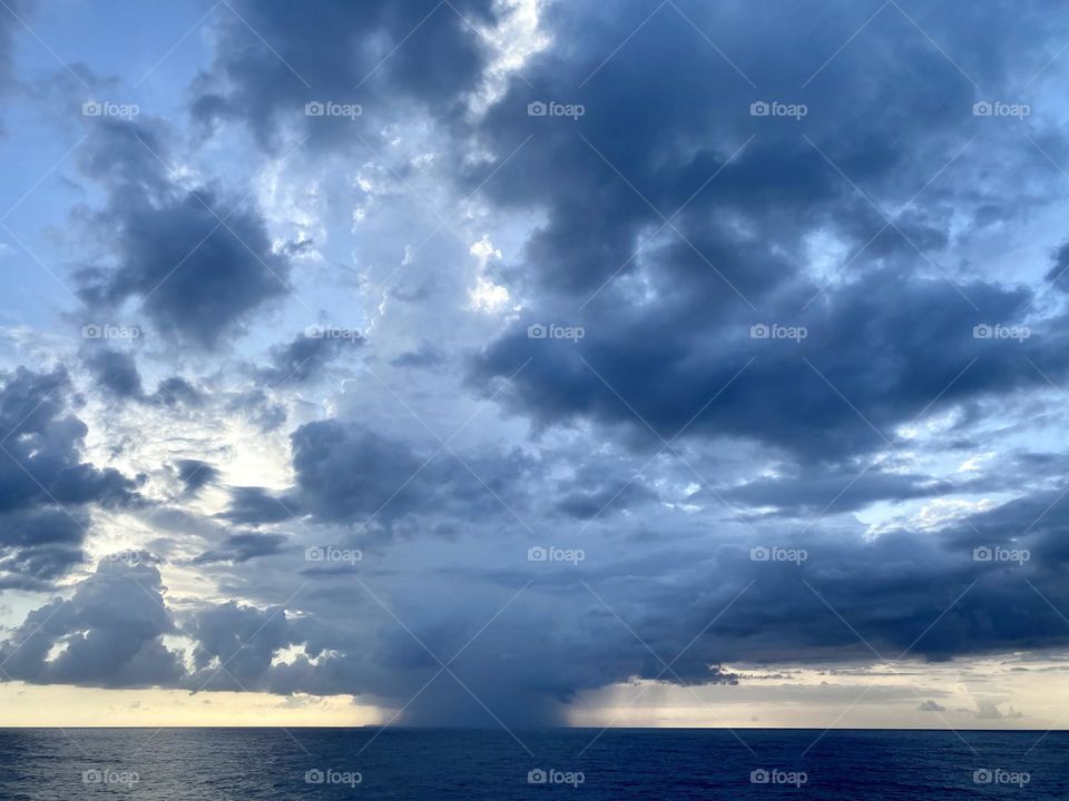 Dark storm clouds over the ocean
