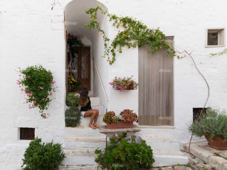 Woman sitting on staircase