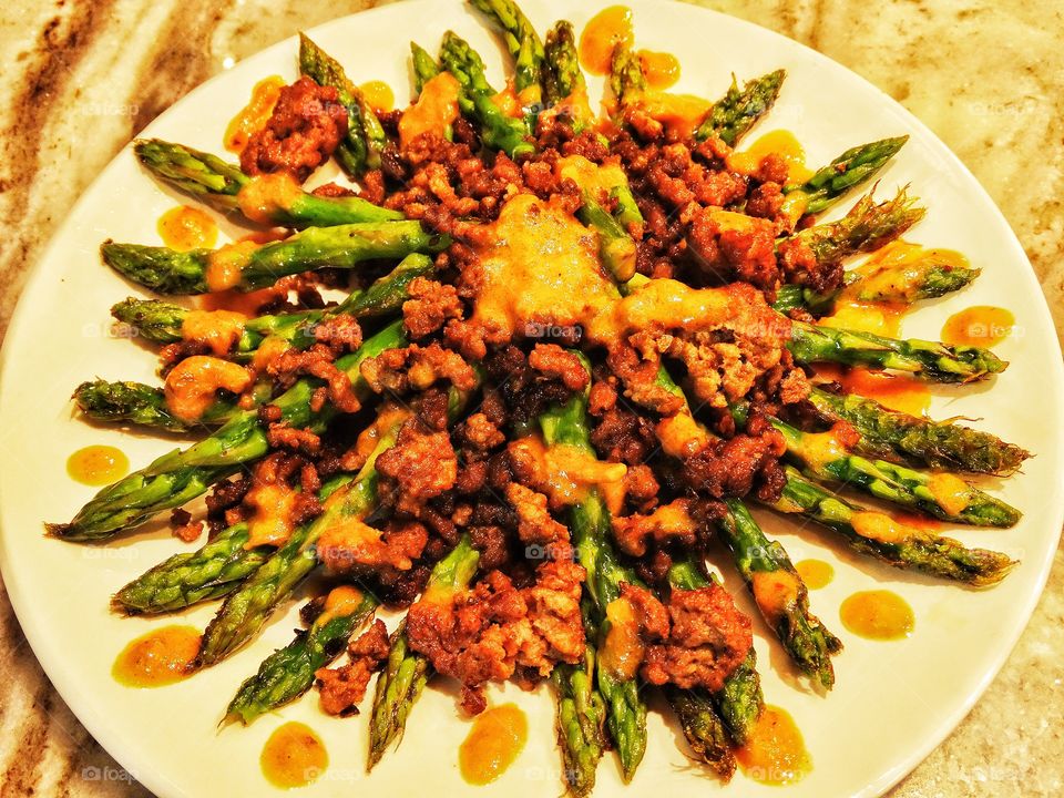 Asparagus With Sausage. Sautéed asparagus with Spanish chorizo sausage tapas