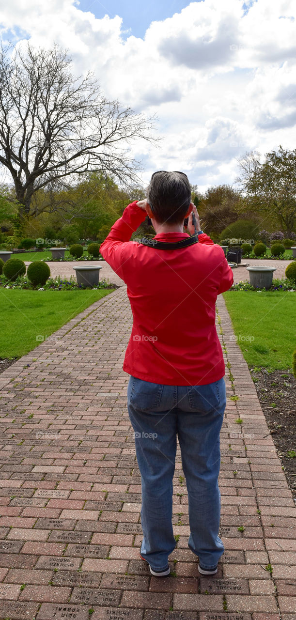 Woman taking a photo of a temple