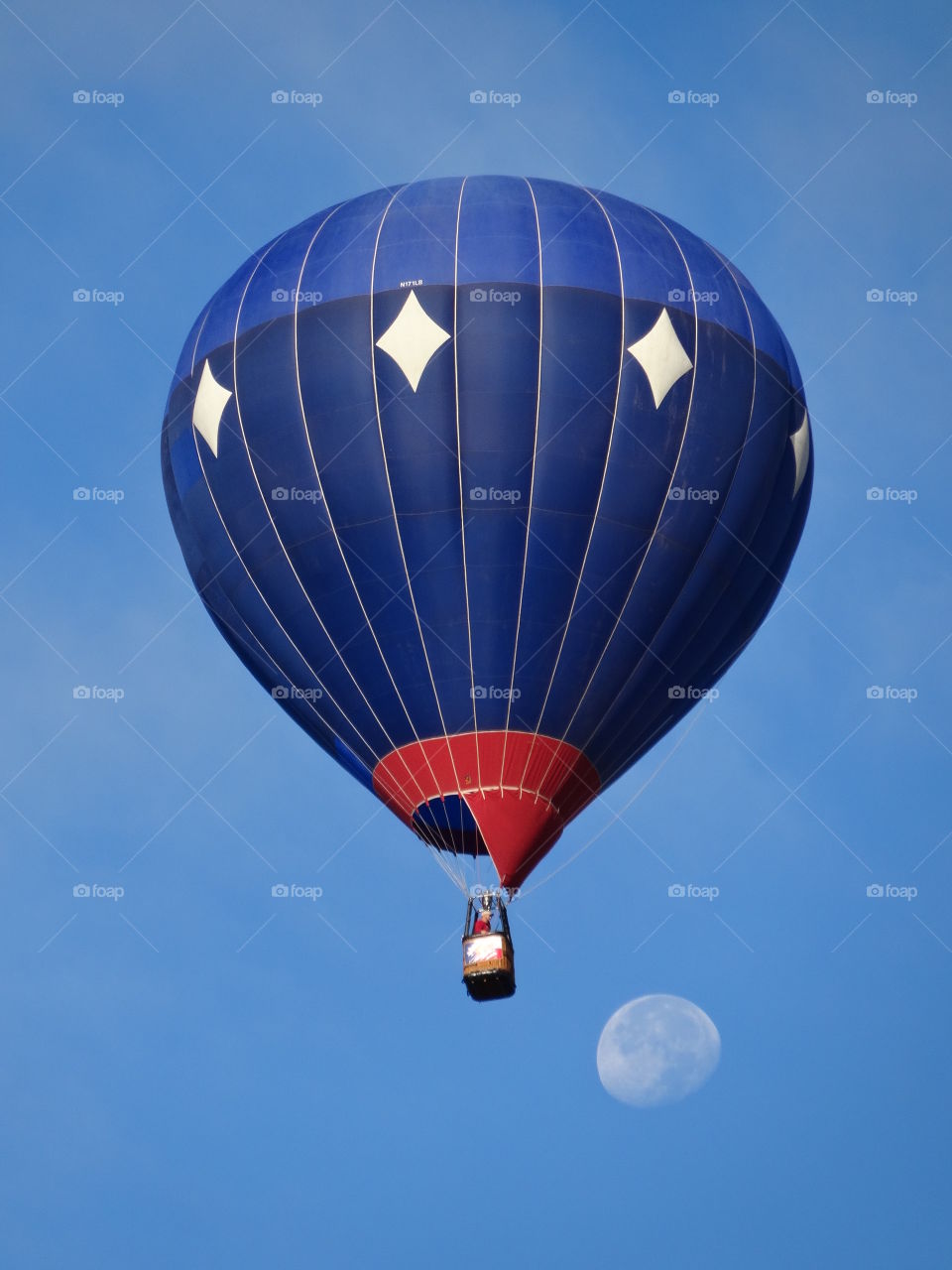 Blue hot air balloon flying in the air
