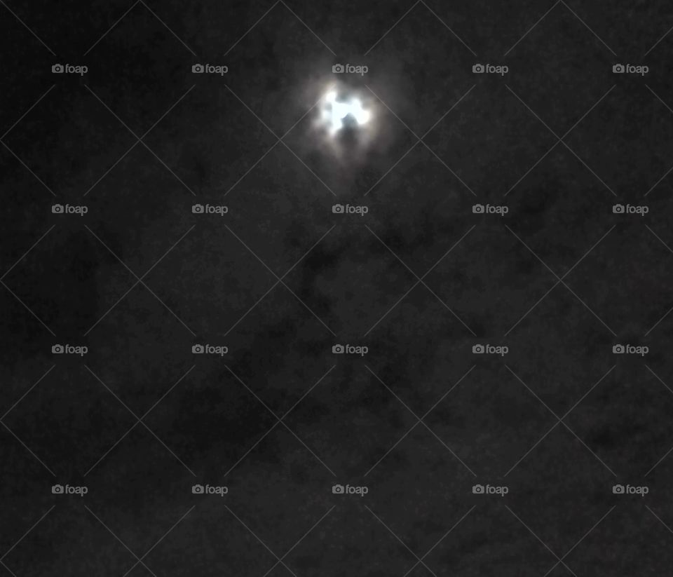 Moon covered by the clouds.