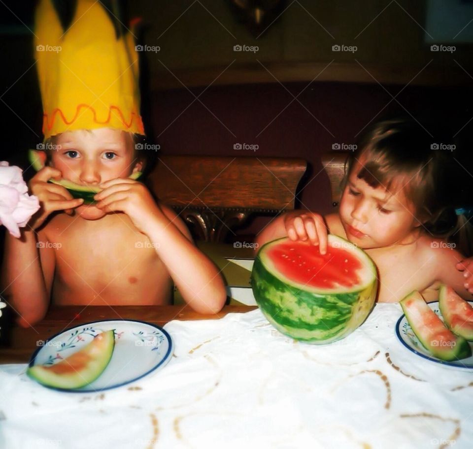 Summer children eating watermelon