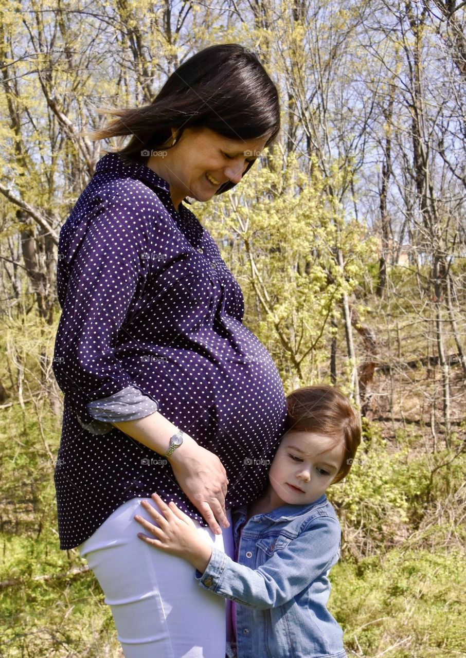 Expectant mother with daughter