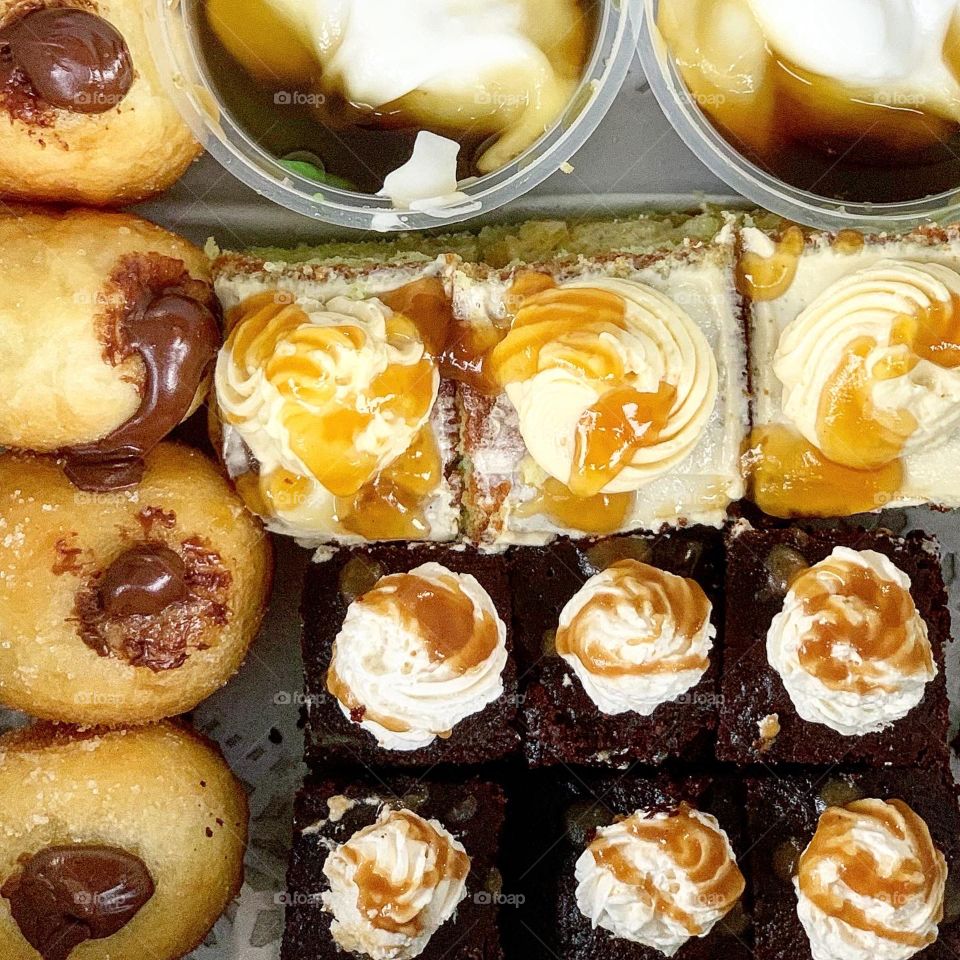 Dessert box including mini bite sized chocolate cakes, jongkong, bombolini flat lay