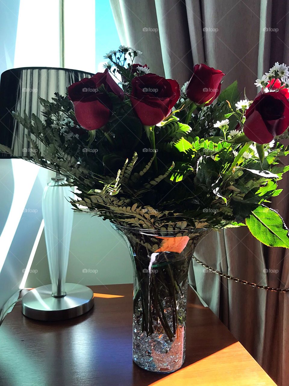 Red roses in crystal vase