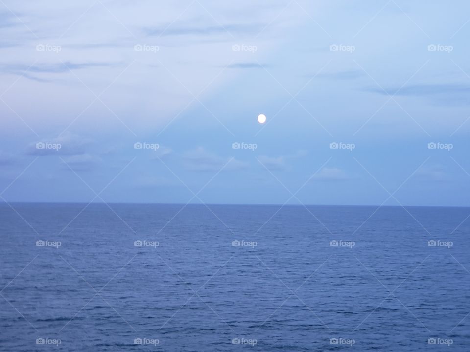 Full moon above the ocean