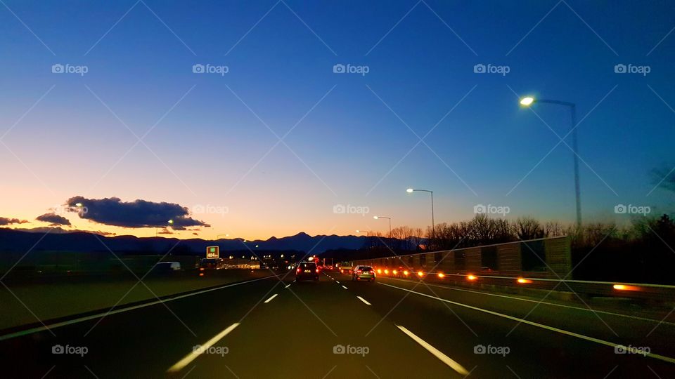 Highway sunset in Italy... winter light going to Roma.