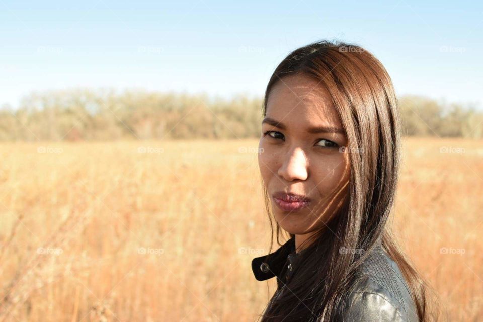 Asian woman in field