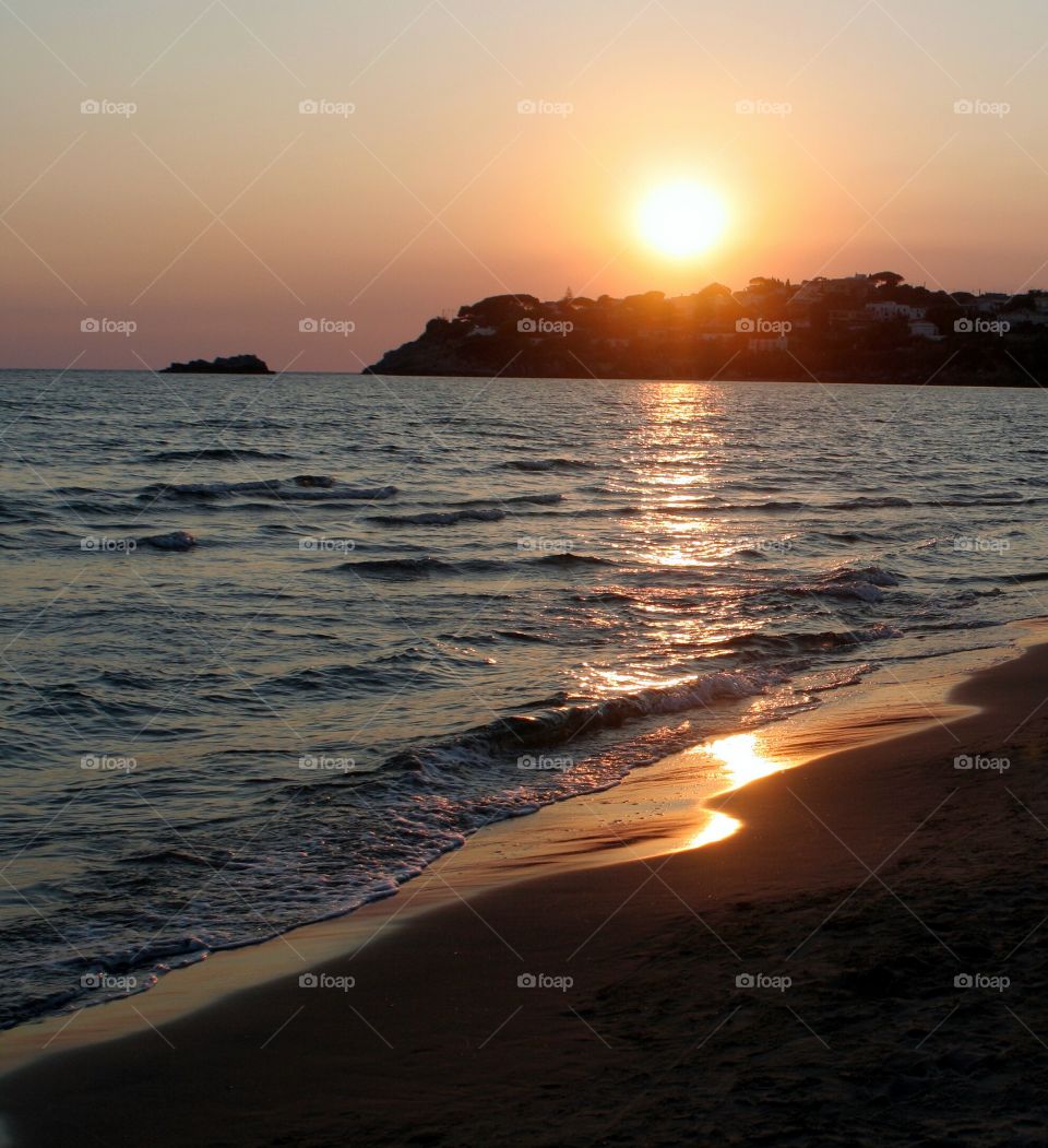 Sunset reflection on beach