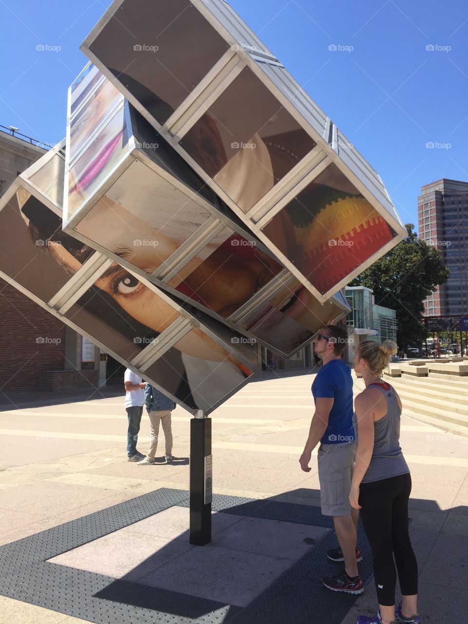 Visitors to the Japanese American National Museum in Los Angeles spin the rotating sculpture in front of the museum.